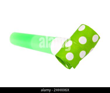 Rolled green in dots festive noisemaker or party whistle horn on the white isolated Stock Photo