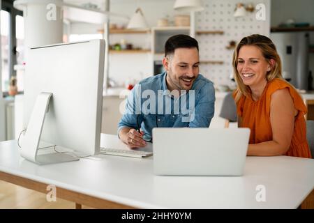 Programmers cooperating at IT company developing apps Stock Photo