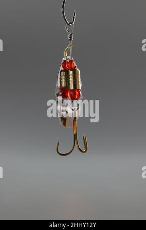 Fishing hook, sharp tip of hook, construction to catch fish in river or lake Stock Photo