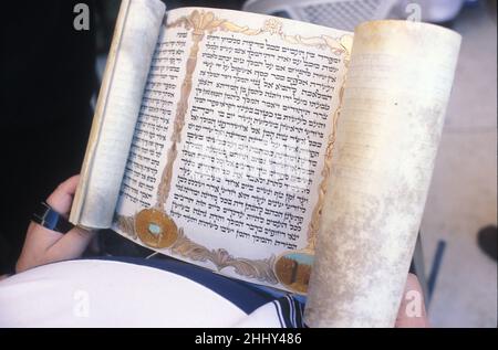 ISRAEL. JERUSALEM.  ULTRA ORTHODOX JEW READ THE MEGILLAH ESTHER BOOK AT THE WESTERN WALL DURING PURIM FESTIVAL Stock Photo