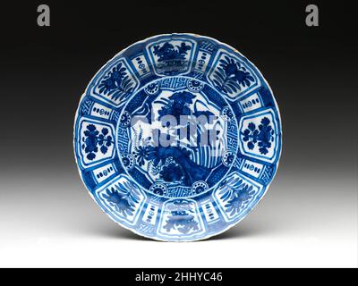 Dish with flowers and birds ca. 1660 Dutch, Delft Most likely introduced from the Islamic world, where it had developed in the ninth century in response to imported Chinese ceramics, the use of a tin-based glaze to cover a dark earthenware body has a long history in Europe. Here, the tin glaze is painted with blue pigment on a plate whose shape and design parallel Chinese kraak ware.. Dish with flowers and birds  196577 Stock Photo