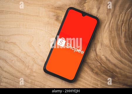 Shopee application on smartphone. Top angle shot. Shopee  a Singaporean multinational technology company which focuses on e-commerce Stock Photo