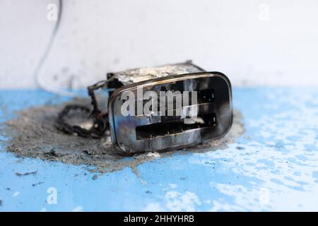 Toaster after fire. Household electrical appliance fire hazard. Overload. Short circuit. Carelessness. Safety in home. Danger home inflammation Insura Stock Photo