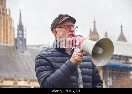 London, UK. 7th December 2021. Jeremy Corbyn speaks to protesters. Demonstrators gathered at Parliament Square with the puppet Little Amal in support of refugees and in opposition to the Nationality and Borders Bill, which was debated by the government. Stock Photo