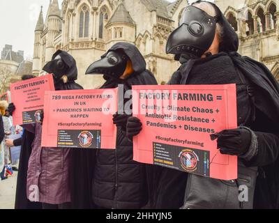 London, UK 25th January 2022. Animal rights activists gathered outside the Royal Courts of Justice in protest against factory farming, as the Scrap Factory Farming group launched its legal challenge against DEFRA for failing to take adequate precautions against the known pandemic risks of factory farming. Stock Photo