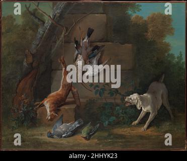 Dog Guarding Dead Game 1753 Jean-Baptiste Oudry French Hunting played a large role in eighteenth-century aristocratic and court culture, and Oudry made his reputation as the period’s leading animal painter. He renders each species’s fur and feathers exactingly, though the artifice of the scene—its ruined wall that supports the suspended trophies of the hunt—lends a decorative quality.. Dog Guarding Dead Game  437234 Stock Photo