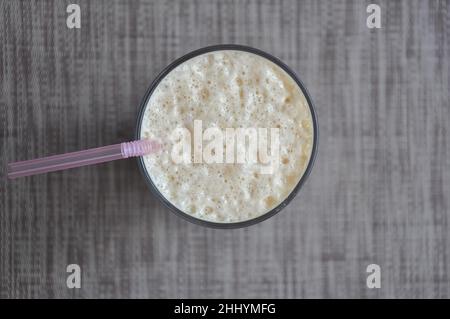 Top view of Lassi in glass over gray background with copy space Stock Photo