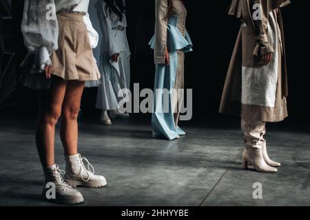 Cropped models in stylish outfits on the runway finale fashion show Stock Photo
