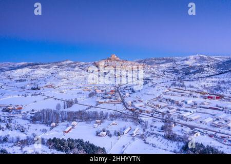 Morella medieval city aerial view in a winter blue hour after a snowfall (Castellón province, Valencian Community, Spain) ESP: Vista aérea de Morella Stock Photo