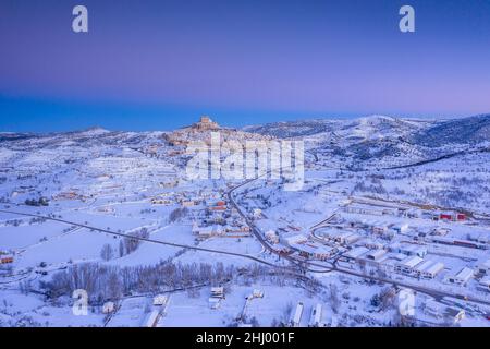 Morella medieval city aerial view in a winter blue hour after a snowfall (Castellón province, Valencian Community, Spain) ESP: Vista aérea de Morella Stock Photo