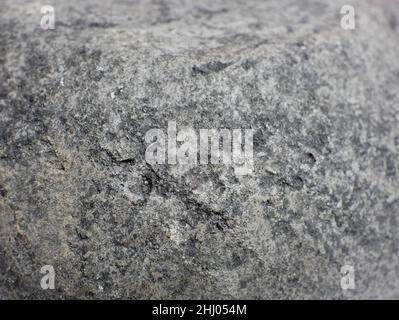 black gray stone surface texture with soft focus. Stock Photo