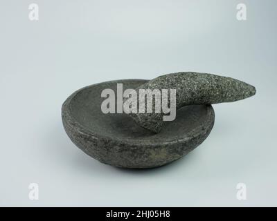 Indonesian traditional mortar and pestle isolated on a white background. Stock Photo