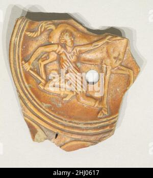 Terracotta oil lamp fragment 1st century A.D. Roman Amazon fallen from a horse.. Terracotta oil lamp fragment. Roman. 1st century A.D.. Terracotta. Early Imperial. Terracottas Stock Photo