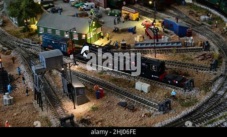 A service crane and class 08 locomotive on a model railway. Stock Photo