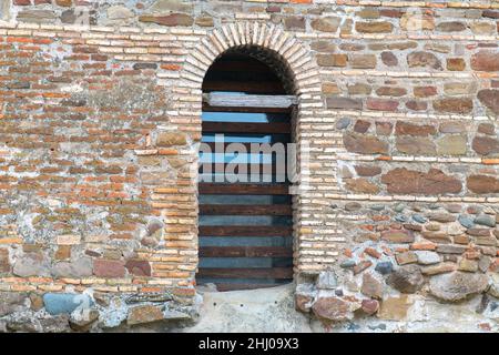 arched entrance to a brick wall in Uplistsikhe in Georgia Stock Photo