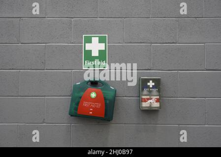 Industrial first aid station on a wall. With copy space. Stock Photo