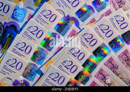 Twenty Pounds Sterling notes showing security hologram printing features. Stock Photo