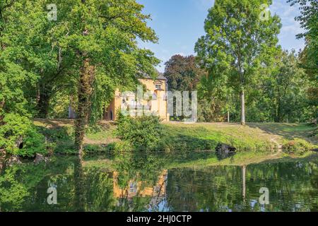 Moenchengladbach - View to Moat and Manor House from aside  at Castle Rheydt , North Rhine Westphalia, Germany, Moenchengladbach 01.09.2017 Stock Photo