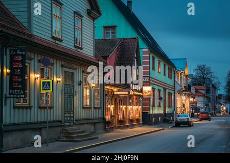 Parnu, Estonia. Night View Of Kuninga Street With Old Buildings, Houses, Restaurants, Cafe, Hotels And Shops In Evening Night Illuminations Stock Photo