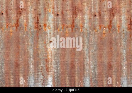 Abandoned old corrugated aluminum sheet with brown rustic texture for background Stock Photo