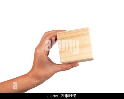 Wooden square cube in hand isolated on the white Stock Photo