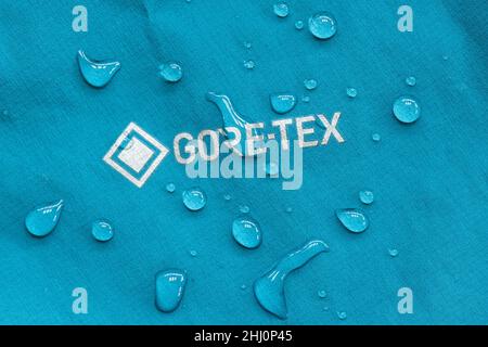 Gore-tex logo with drops of water on waterproof jacket Stock Photo