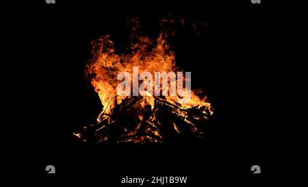 Big campfire blazing in the night outdoors Stock Photo