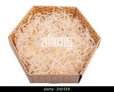 Sawdust in open box for packing gifts on the white Stock Photo