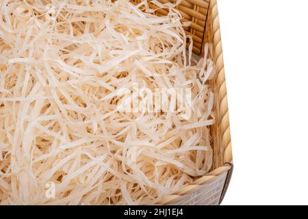 Sawdust in open box for packing gifts on the white Stock Photo