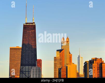 Buildings in the near north side Chicago skyline bask in the late evening sun not long before sunset. Stock Photo