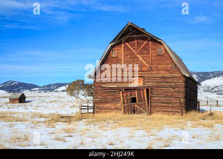 old barn and cabin in winter near jens, montana Stock Photo