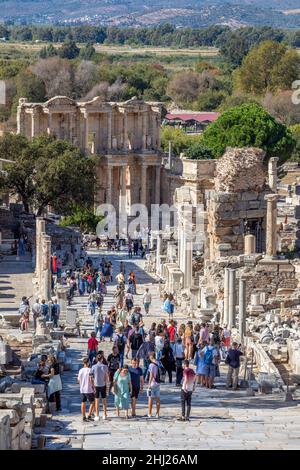 Domestic and foreign tourists among the ruins of the ancient city of Ephesus in Selcuk, Izmir Province, Turkey on October 22, 2021. Stock Photo