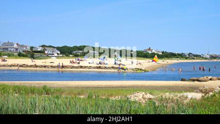 Entrance to the harbor at Lewis Bay with beach tourists.Near the entrance to Hyannis harbor, in Cape Cod Massachusetts,USA. Stock Photo