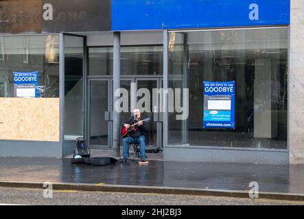 ABERDEEN,SCOTLAND - 24 JANUARY 2022: This is a busker playing in the City Centre of Aberdeen, Scotland on 24 January 2022. Stock Photo