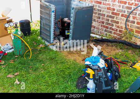 Maintenance being performed on air conditioner system Stock Photo