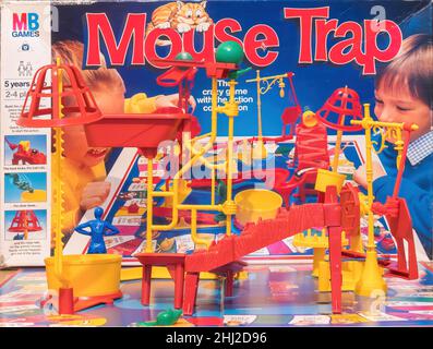 A view of the fully assembled Mouse Trap board game with the MB Games  box the game comes in, in the background. Stock Photo