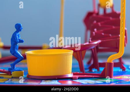 Close up image of the Diver on Mouse Trap Board Game ready to dive into the yellow Pool which sets of the mouse trap. Stock Photo
