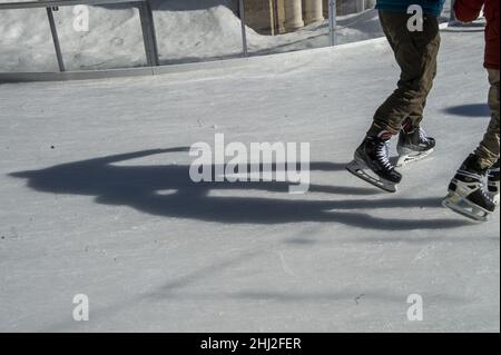 Washington, United States. 26th Jan, 2022. A father and son hold hands while skating at the Washington Harbour Ice Rink in Georgetown, Washington DC on Wednesday, January 26, 2022. Photo by Bonnie Cash/UPI Credit: UPI/Alamy Live News Stock Photo