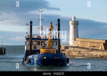 BUCKIE,MORAY, SCOTLAND - 23 JANUARY 2022: This is the Moray Council owned Dredger boat called Selkie arriving back at Buckie Harbour, Moray, Scotland Stock Photo