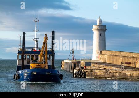 BUCKIE,MORAY, SCOTLAND - 23 JANUARY 2022: This is the Moray Council owned Dredger boat called Selkie arriving back at Buckie Harbour, Moray, Scotland Stock Photo