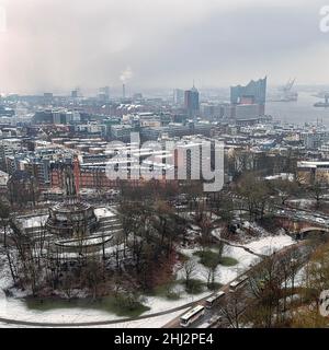 View from above of the Old Elbe Park with Bismarck Monument, Elbe Philharmonic Hall in the haze, dreary winter weather, Hamburg, Germany Stock Photo