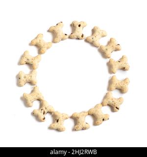 Circle of heathy bone shapes  biscuits treats  used for training and occasions ,  white isolated background  for text over-lay , copy space , packagin Stock Photo