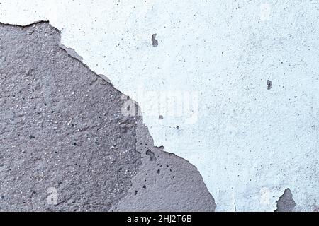 Cement wall texture and weathered white paint. White painted and peeling wall background. Stock Photo