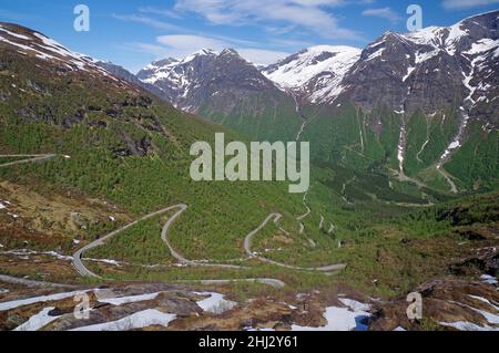 Mountain pass in Zig Zag, spring-like landscape with snowfields, barren mountains, Fjell, Gaularfjellet, Gaular, Norway Stock Photo