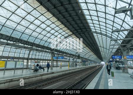 Waiting passengers, Spandau railway station, Berlin, Germany Stock Photo