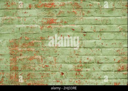 Shabby old brick wall painted green horizontal Stock Photo