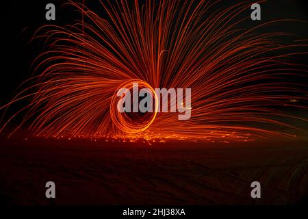 Circles with sparks on a black background Stock Photo