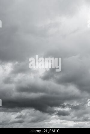 Low angle view of gray clouds. Dark cloudy sky before thunderstorm. Storm heaven... Stock Photo