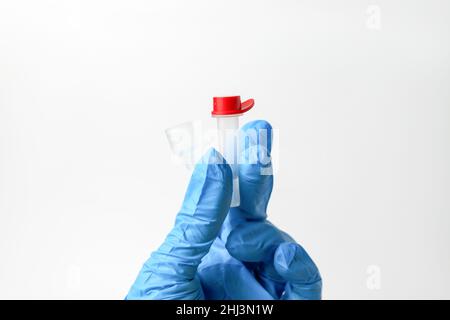Lateral-Flow-Test covid rapid home- step 3 - squeeze and shake plastic tube Stock Photo