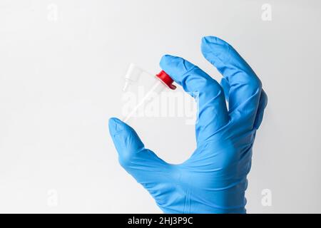 Lateral-Flow-Test covid rapid home- step 3 - squeeze and shake plastic tube Stock Photo